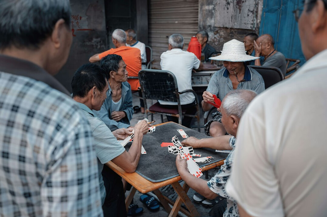 elderly group playing cards
