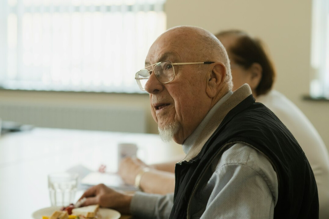seniors enjoying meal together