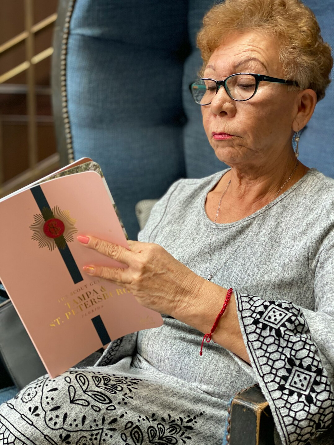 Seniors reading together in a cozy book club circle