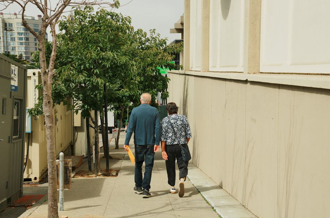 senior couple walking in neighborhood